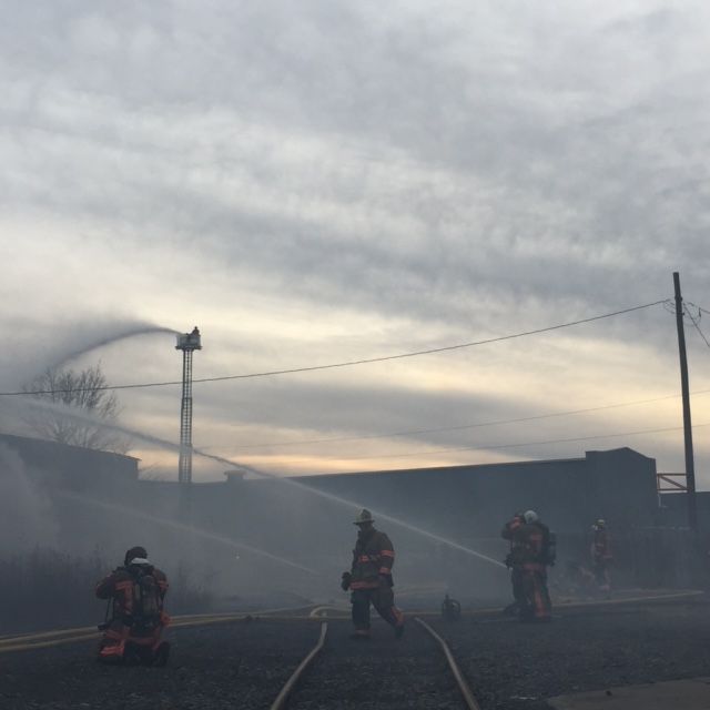 Firefighters douse the roundhouse.